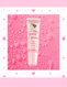 Lip balm on a pink background with water droplets