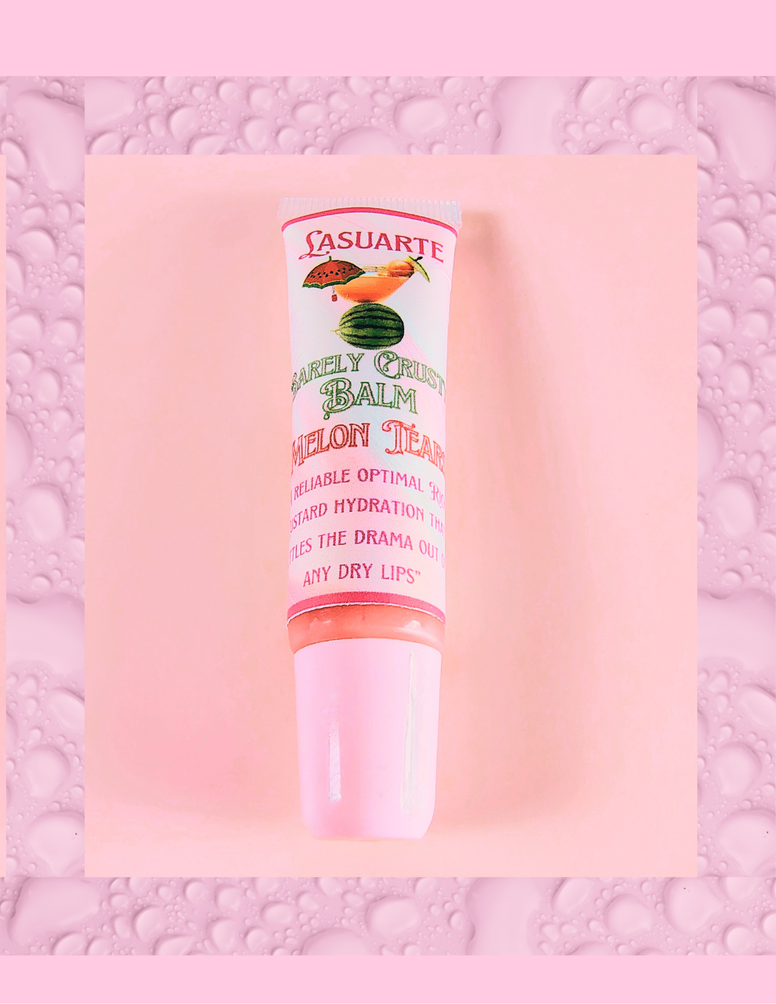Lip balm tube with 'lasuarte branding on a pink background